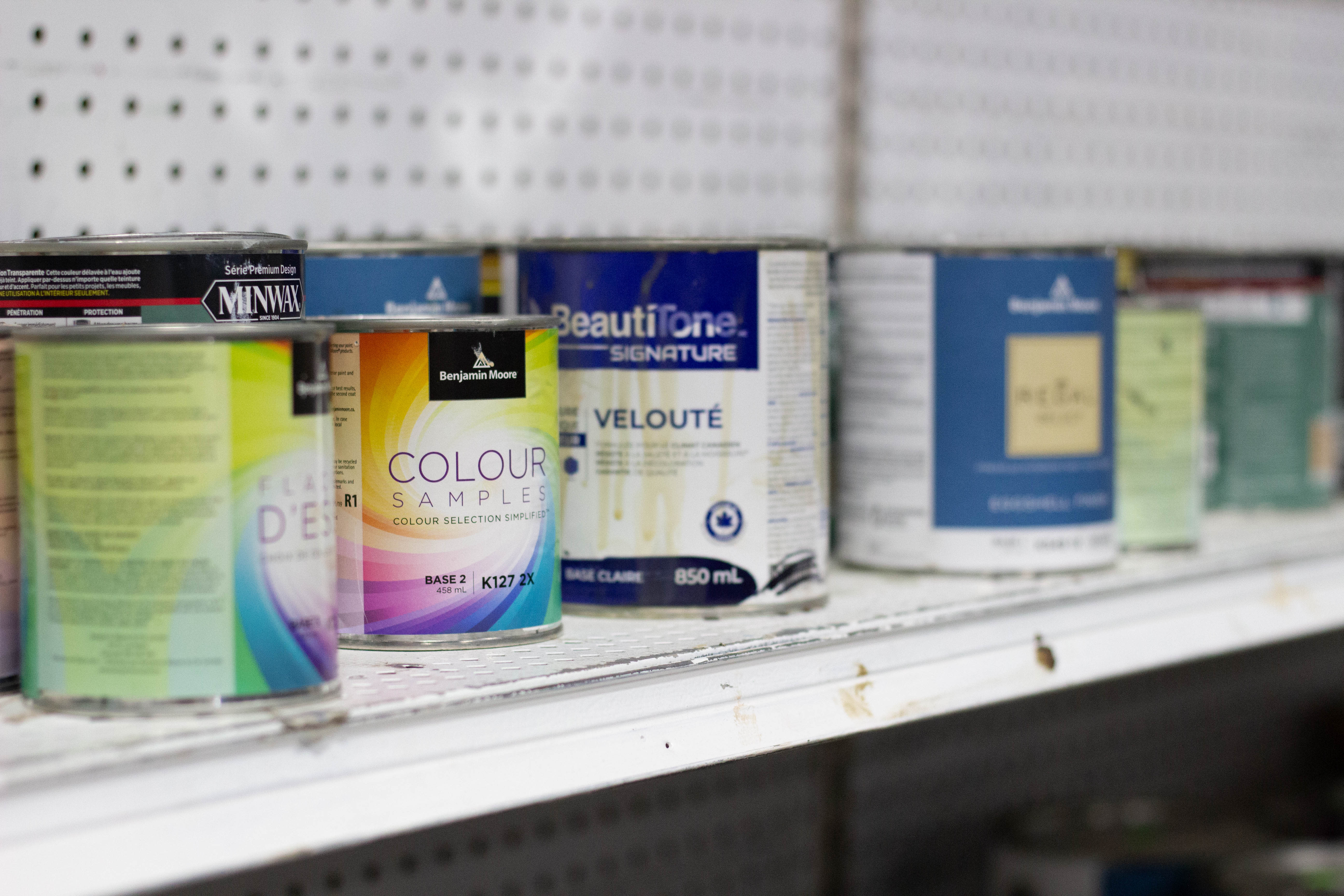 Paint cans on shelf at Habitat for Humanity ReStore